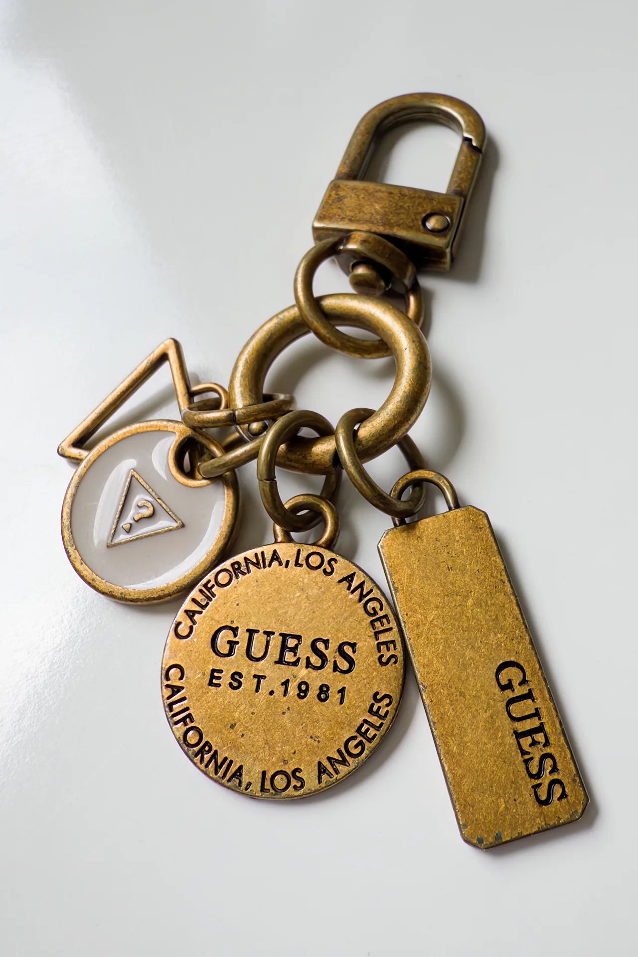#157 Guess Keychain Gold | c. 169