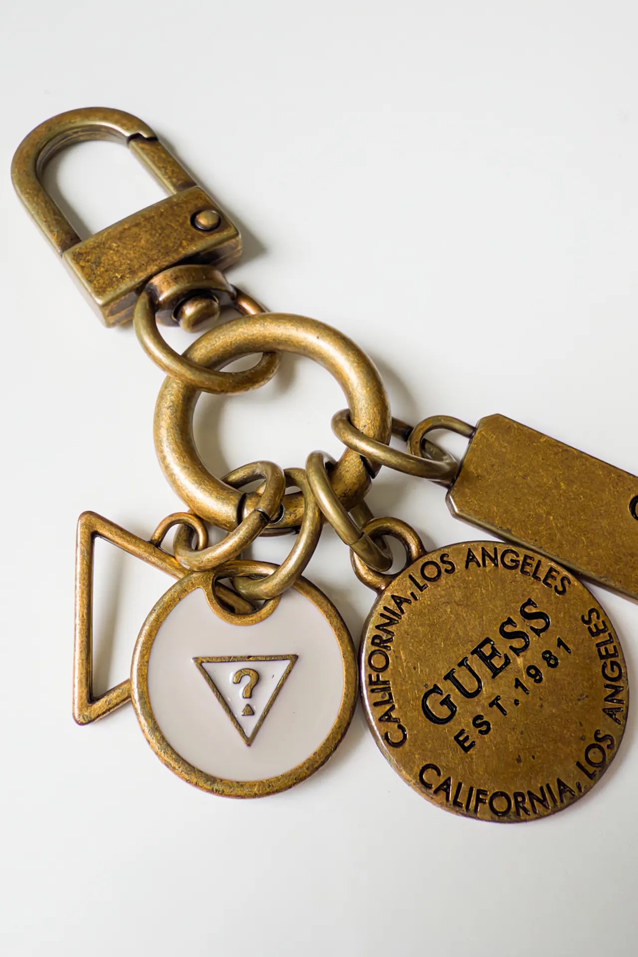 #157 Guess Keychain Gold | c. 169