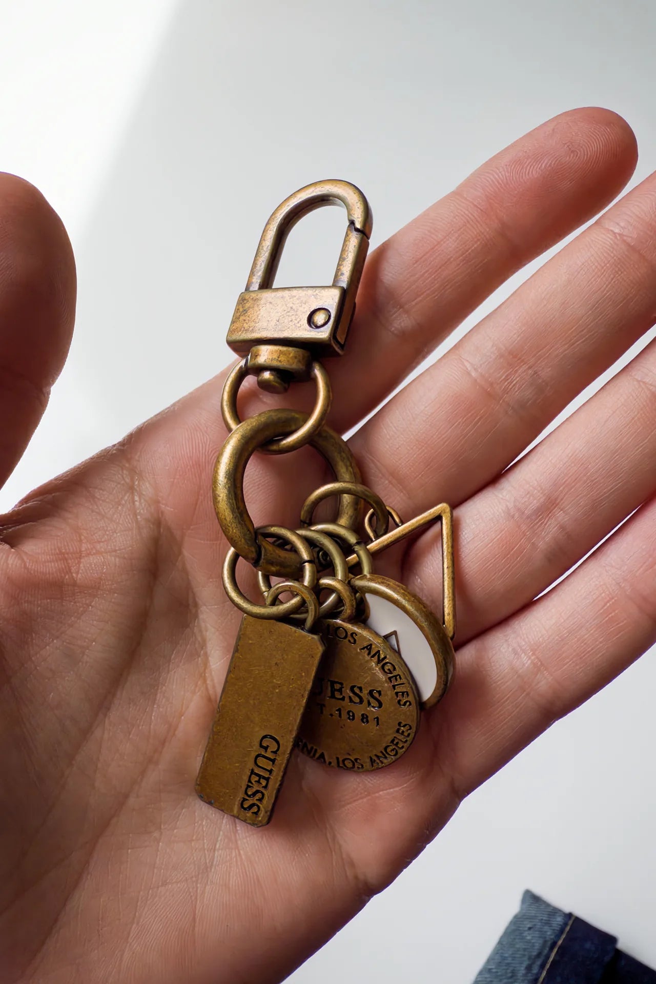 #157 Guess Keychain Gold | c. 169