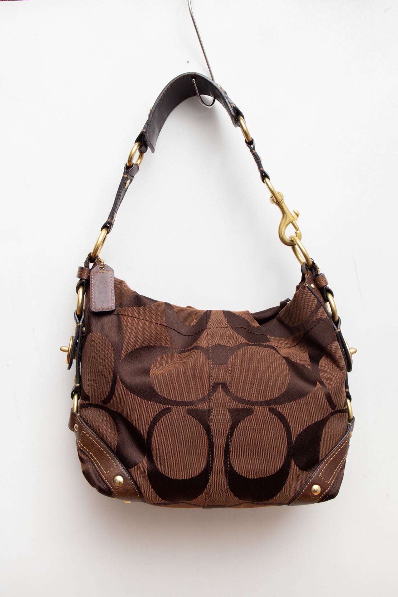 #210 Coach brown monogram bucket bag | c. 154