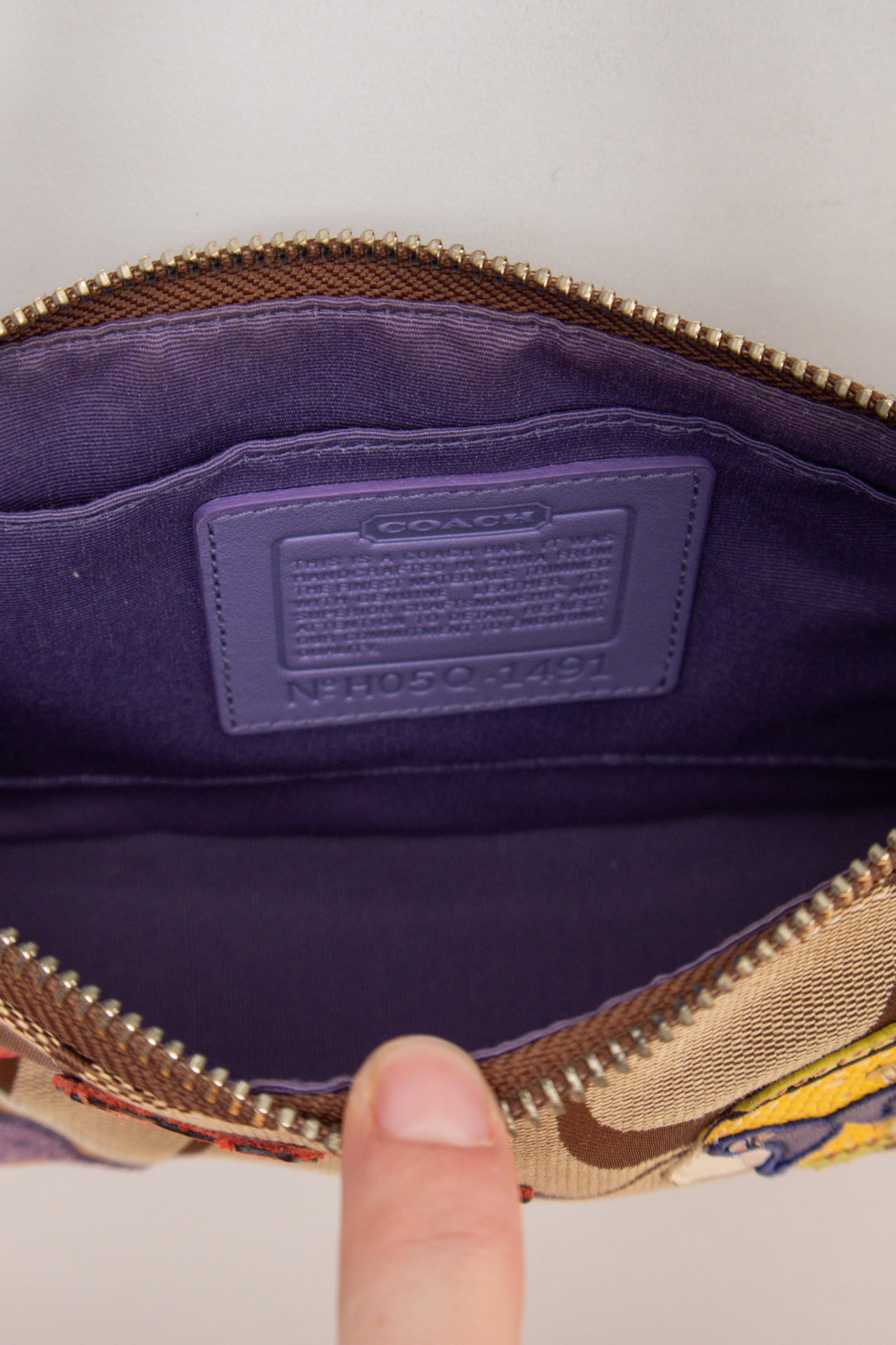 #242 Coach purple fish monogram demi bag | c. 163