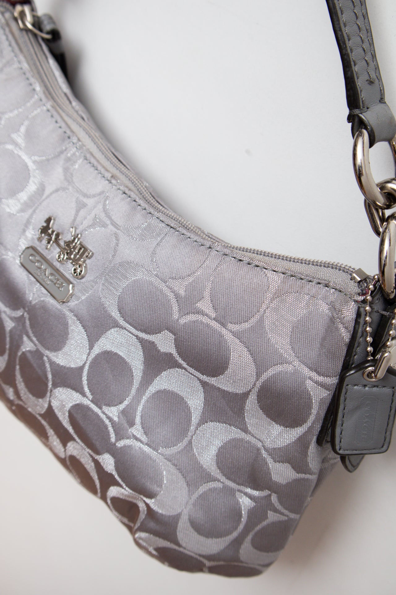 #231 Coach silver monogram bag | c. 165