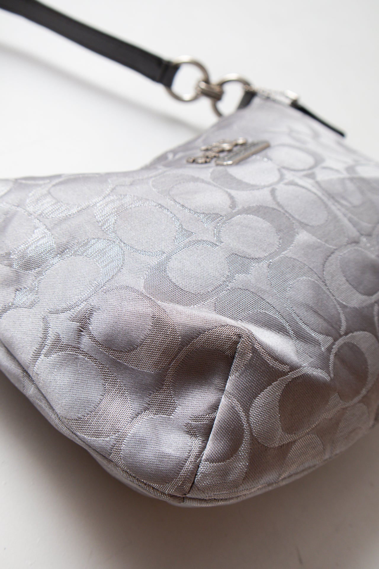 #231 Coach silver monogram bag | c. 165