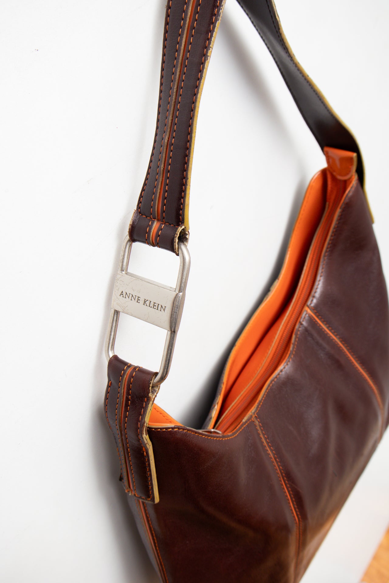 #242 Ann Klein patent leather orange stitch bag | c. 165
