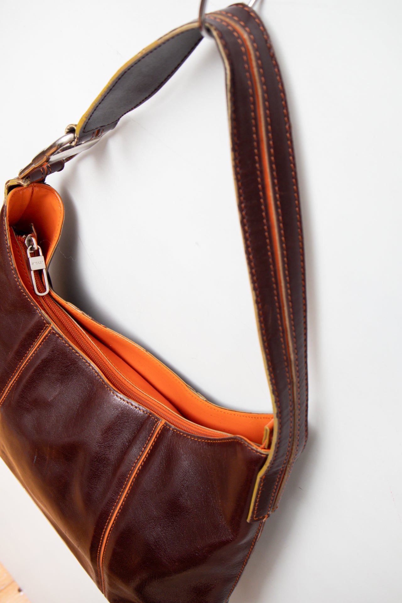 #242 Ann Klein patent leather orange stitch bag | c. 165
