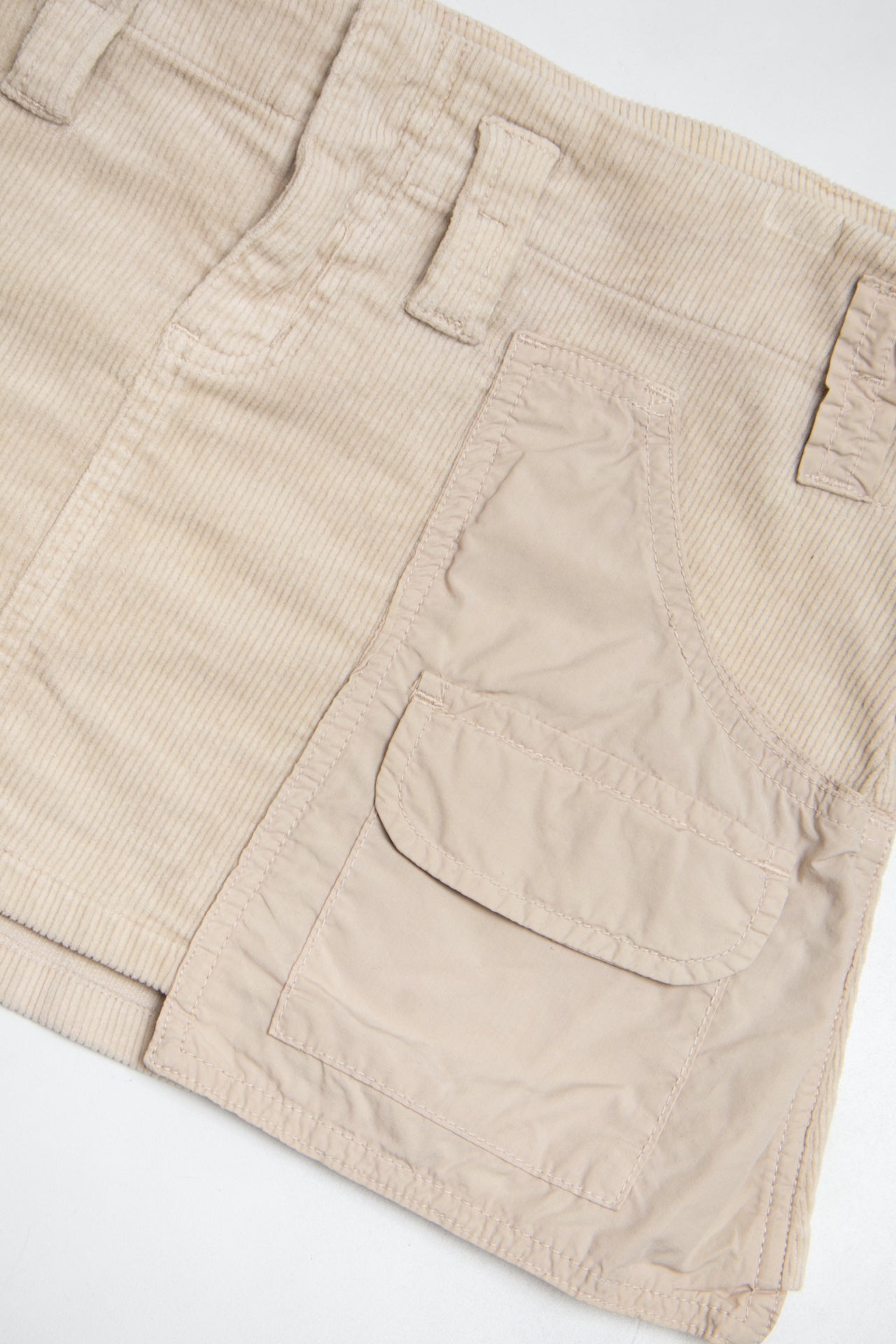 #178 Evo-e Mini Skirt Beige | c. 199 | Size 12