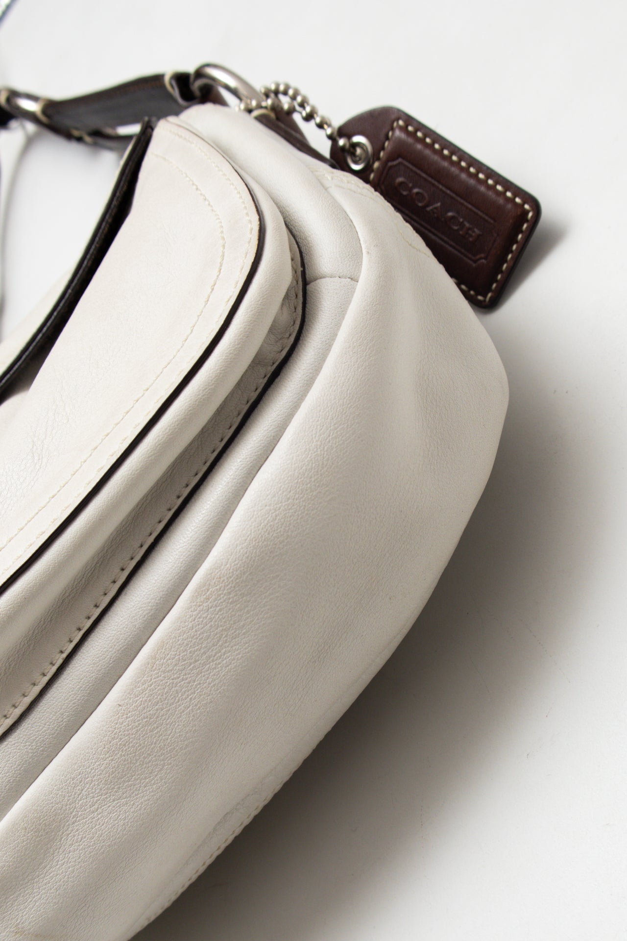 #238 Coach Soho Flat Bag White | c. 175