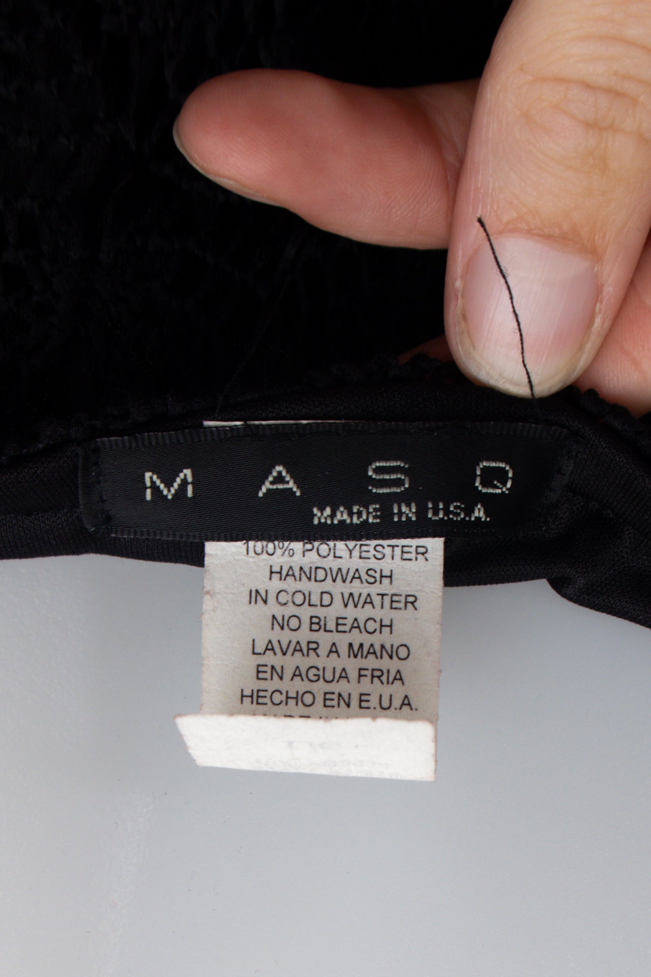 #105 Masq Black | c. 175 | Size 10/12